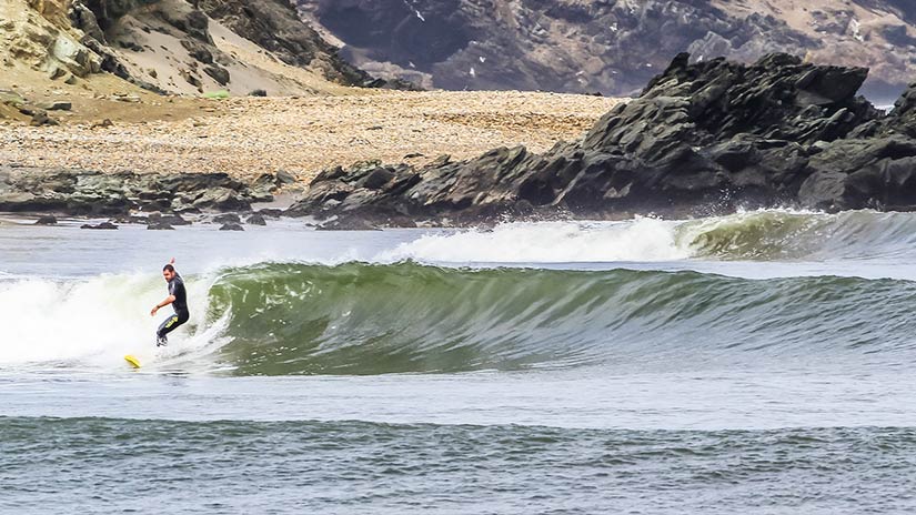surfing in peru in the longest left wave